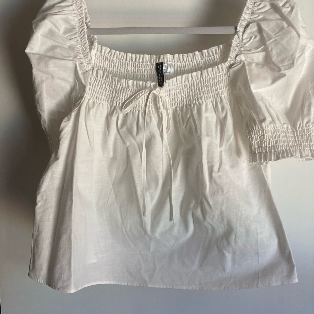 Divided white puff sleeved elastic chest & sleeves. Size L